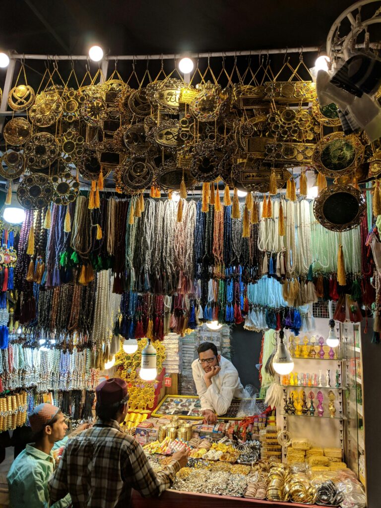 Explore a colorful Indian market stall filled with vibrant beads, jewelry, and trinkets.